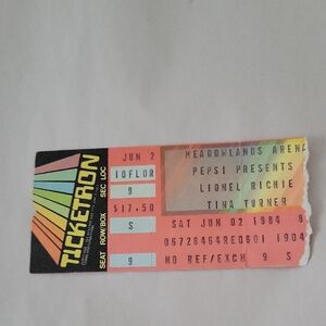 Vintage Concert Ticket with Rainbow Design